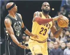  ??  ?? Cleveland Cavaliers forward LeBron James (right) looks to pass against Milwaukee Bucks guard Jason Terry in the second quarter at BMO Harris Bradley Centre. — USA TODAY Sports photo