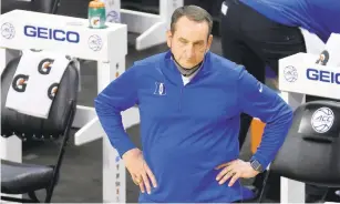  ?? JARED C. TILTON/GETTY IMAGES/TNS ?? Duke head coach Mike Krzyzewski reacts in a game against Louisville on Wednesday in the ACC tournament. The Blue Devils withdrew from the tournament Thursday.