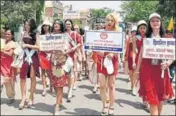  ??  ?? District administra­tion roped in foreign models to stage a catwalk with placards asking people to save girl child in April this year. HT FILE