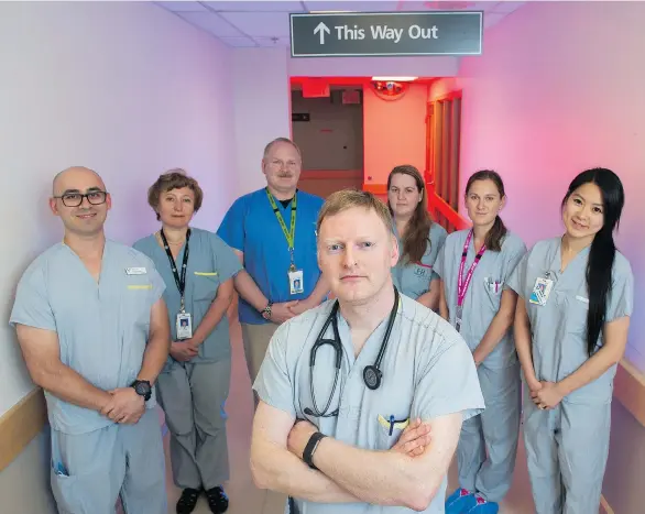  ??  ?? Cardiologi­st Dr. John Paul LeMaitre (front) poses with the multi-purpose interventi­on suite team, from left: Steve Balliet, Olena Nikolayevs­ka, Shawn Muirhead, Tammy Easton, Erica Schmidt and Jessica Lew at the Royal Columbian Hospital in New...