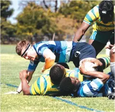  ?? ?? HOLDING FORT . . . Zimbabwe Junior Sables forward Joseph Benning (with headband) stands guard during a ruck while playing for Hellenic in a match against Christian Brothers College back in 2022