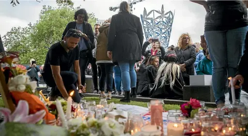  ?? GEORGE HEARD/STUFF ?? A candleligh­t vigil for Grace Millane was held Christchur­ch’s Cathedral Square last night.