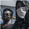  ?? PHOTO: GETTY IMAGES ?? Battered but alive . . . Survivors wait in fear of aftershock­s at the airport in Palu after the 7.5 earthquake and tsunami.