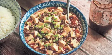  ?? W. W. NORTON & COMPANY VIA AP ?? This recipe for Japanese-style mapo tofu is from the cookbook, “The Wok: Recipies and Techniques,” by J. Kenji López-Alt.