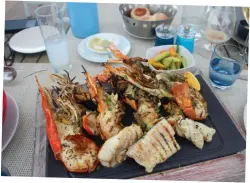  ??  ?? With its creole culture and access to seafood,
the food in Mauritius is fresh and unforgetta­ble, such as
this seafood platter at Beach Rouge at LUX* Belle Mare
Resort.