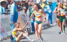  ??  ?? Beki Smith consoles disqualifi­ed Claire Tallent as she finishes the women’s 20km race walk (left) before Tallent embraces gold medallist Jemima Montag at the finish line.