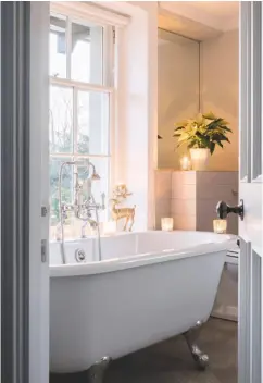  ??  ?? BATHROOM The roll-top bath was positioned to enjoy the views across the parkland. try the Astonian rimini bath, £1,199.91, Aston Matthews