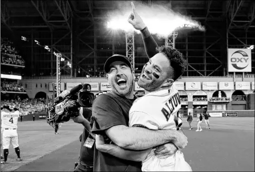  ?? Matt Slocum The Associated Press ?? American League Championsh­ip Series MVP Jose Altuve, right, gets a lift from starting pitcher Justin Verlander after Altuve’s two-run homer in the ninth inning gave the Houston Astros a 6-4 win over the New York Yankees and a World Series berth.