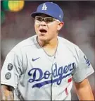  ?? John Hefti / Associated Press ?? San Francisco Giants pitcher Logan Webb, left, and Los Angeles Dodgers pitcher Julio Urias, right, will face off in Game 5 of the NLDS Thursday.