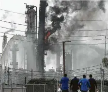  ?? Jon Shapley / Staff photograph­er ?? Wednesday’s petrochemi­cal blaze at Exxon Mobil’s Olefins facility in Baytown is the fourth in the Houston area this year.