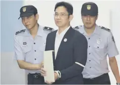  ??  ?? Lee Jae-yong arrives in court before his sentence hearing
