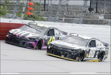  ??  ?? Jimmie Johnson (48) and Alex Bowman (88) come down a straightaw­ay during the NASCAR Cup Series auto race on May 17, in Darlington, South Carolina. (AP)