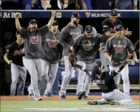  ?? CHARLIE RIEDEL — THE ASSOCIATED PRESS FILE ?? Cleveland Indians first baseman Carlos Santana celebrates after making the final out in their 3-0 win over the Toronto Blue Jays in Game 5 of baseball’s American League Championsh­ip Series in Toronto. Four months after LeBron James and the Cavaliers...