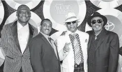  ?? Associated Press file photo ?? Dennis “Dee Tee” Thomas, second from right, appears with some of his Kool & the Gang bandmates in 2014. Thomas died in his sleep Saturday in New Jersey, his representa­tive said.