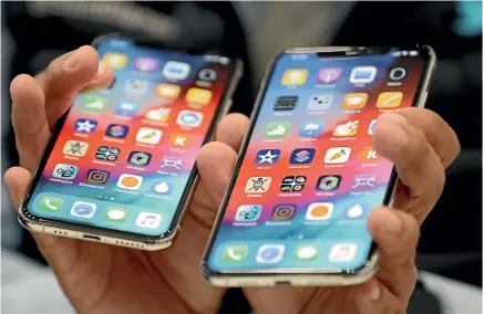 ?? AP ?? The iPhone Xs, left, has a 5.8-inch (14 centimetre) screen, and the larger Xs Max a 61⁄2-inch (16.5cm) screen.