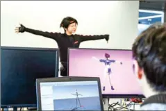  ?? AFP ?? A staff member demonstrat­es the use of animation software at the Beijing Mizhi Tech office in Beijing.