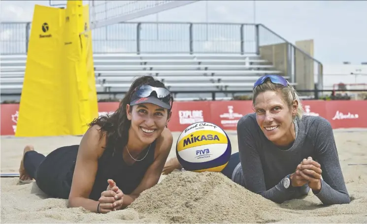  ?? Ed Kaiser ?? Melissa Humana-paredes, left, and Sarah Pavan at the official kickoff of the FIVB Beach Volleyball World Tour at the former Northlands Park Race Track on Tuesday.