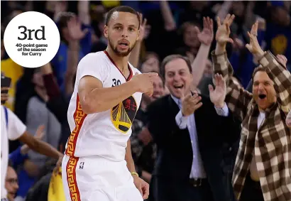  ?? AP ?? Golden State Warriors co-managing partners Peter Guber (right) and Joe Lacob (left) applaud a score made by Stephen Curry (30) during the match against Los Angeles Clippers on Saturday. —