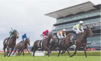  ?? Picture: AAP IMAGE ?? Into The Abyss, ridden by Glyn Schofield (front), wins at Randwick yesterday.