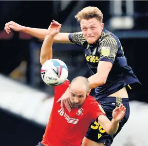  ??  ?? IMPACT: Nick Powell, pictured celebratin­g his weekend goal, faces a late fitness test tonight, while, above, Harry Souttar continues to impress in defence.