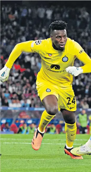  ?? ?? On the run: Andre Onana knocks the ball past City striker Erling Haaland during the Champions League final