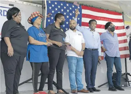  ?? MICHAEL LAUGHLIN/SUN SENTINEL ?? Several elected officials stand on stage to speak during the John Lewis Voting Rights Act event to raise awareness of the urgent need to protect voting rights, in Pompano Beach Saturday.