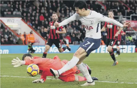  ??  ?? Son Heung-min puts Tottenham 3-1 up against Bournemout­h at the Vitality Stadium yesterday.