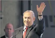  ?? TSAFRIR ABAYOV — THE ASSOCIATED PRESS ?? Israeli Prime Minister Benjamin Netanyahu waves during the opening ceremony for a bomb-proof emergency room in a hospital in Ashkelon, Israel, on Tuesday.