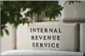  ?? PATRICK SEMANSKY — THE ASSOCIATED PRESS FILE ?? A sign outside the Internal Revenue Service building is seen on May 4, 2021 in Washington. Tax Day reveals a major split in how Joe Biden and Donald Trump would govern: The presidenti­al candidates have conflictin­g ideas about how much to reveal about their own finances and the best ways to boost the economy through tax policy.