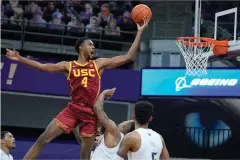  ?? The Associated Press ?? USC forward Evan Mobley (4) shoots against Washington during the second half of a Feb. 11 game in Seattle.