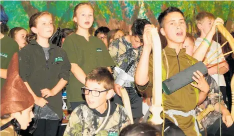  ??  ?? Seniors from Brunswick School (above) practised firing arrows with a bow for weeks at Marangai Archery Club in preparatio­n for their performanc­es.