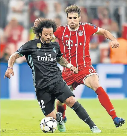  ?? Picture: GETTY IMAGES ?? IN CONTROL MODE: Marcelo of Real Madrid holds off Javi Martinez of Bayern Munich during their Champions League semifinal first leg match at the Allianz Arena in Munich, Germany, on Wednesday. The return leg will be played on Tuesday