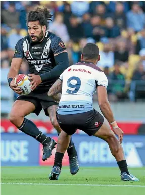  ??  ?? Kiwis captain Adam Blair tries to get his side going forward against Fiji at Westpac Stadium last night.