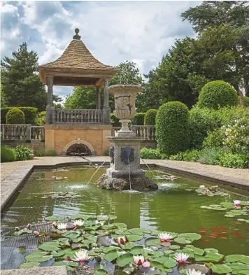  ??  ?? Above: The waterlily pond focuses on a Lutyens-esque rill and semi-circular ‘source’, beneath a gazebo in the Arts-and-crafts style. Facing page: A fine cedar presides over new stone walling, steps and carved finials