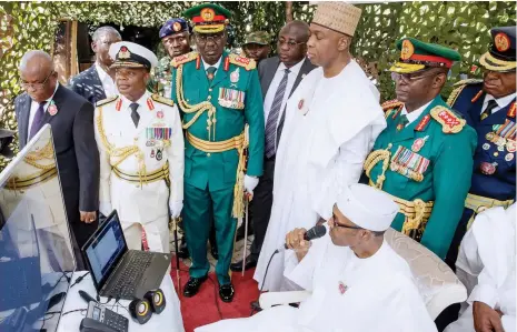  ?? Photo: Felix Onigbinde ?? President Muhammadu Buhari speaks with Military men in Operation base via NigComSat. With him are, Chief Justice of Nigeria, Walter Onnoghen; Chief of Naval Staff, Vice Admiral, Ibok-Ete Ekwe Ibas; Chief of Army Staff, Lt General Tukur Yusuf Buratai;...