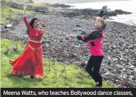  ??  ?? Meena Watts, who teaches Bollywood dance classes, offers Darcey an impromptu lesson on the shoreline