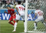  ?? ALASTAIR GRANT — THE ASSOCIATED PRESS ?? England’s Harry Kane scores his side’s 2nd goal against Tunisia during a group G match at the 2018soccer World Cup in the Volgograd Arena in Volgograd, Russia, Monday.