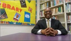  ?? ERIC BONZAR — THE MORNING JOURNAL ?? Dr. Anthony Richardson sits in the library of Hawthorne Elementary School, June 15. Richardson—program officer for the Nord Family Foundation and newly appointed chair of the Lorain Academic Distress Commission—said he attributes his ability to...