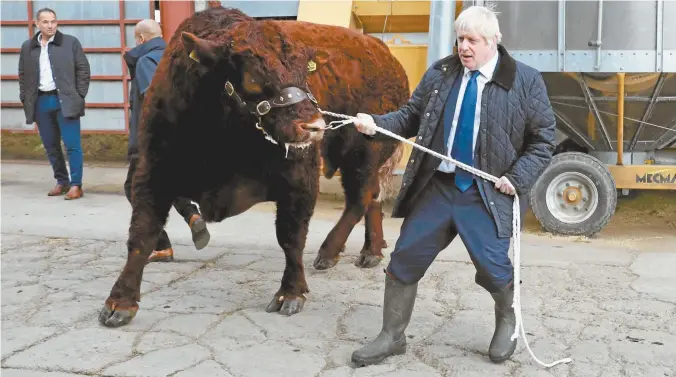  ??  ?? British Prime Minister Boris Johnson during a visit to a farm near Aberdeen, Scotland, last week.