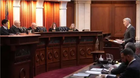  ?? David Zalubowski/Associated Press ?? Attorney Eric Olson, far right, who argued to bar Donald Trump from the ballot, argues before the Colorado Supreme Court on Dec. 6 in Denver.