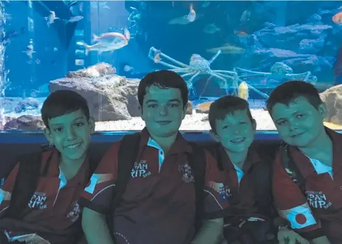  ??  ?? SIGHTS TO SEE: St Francis Xavier's students Lucas McCarthy, Declan Cantamessa, Thomas Dummel and Kobe Davis with giant crabs at the Osaka Aquarium during a recent school trip to Japan.