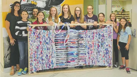  ?? [WHITNEY NEILSON / THE OBSERVER] ?? Teacher Keri Beu with the core group of volunteers at Wellesley PS. Once completed, mats will be shipped to points around the globe, from Haiti to Zambia.