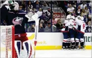  ?? JAY LAPRETE AP PHOTO BY ?? Washington Capitals players celebrate their goal against the Columbus Blue Jackets during the third period of Game 6 of an NHL first-round hockey playoff series Monday, April 23 in Columbus, Ohio. The Capitals defeated the Blue Jackets 6-3.