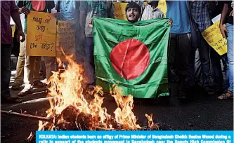  ??  ?? KOLKATA: Indian students burn an effigy of Prime Minister of Bangladesh Sheikh Hasina Wazed during a rally in support of the students movement in Bangladesh near the Deputy High Commission Of Bangladesh office. —AFP