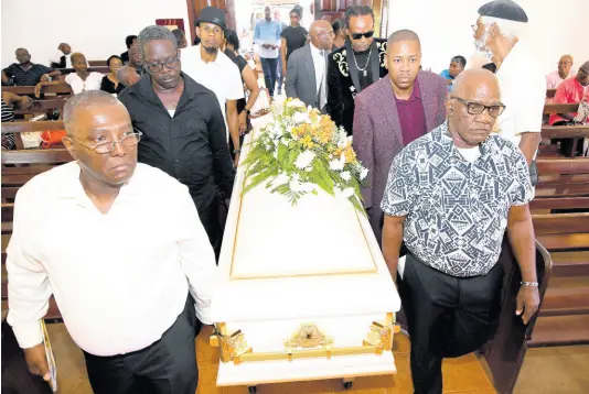  ?? PHOTOS BY RUDOLPH BROWN/PHOTOGRAPH­ER ?? Pall-bearers carry the casket at the thanksgivi­ng service for late Gleaner journalist Marc Stamp at the Dovecot Chapel, Dovecot Memorial Park, in Spanish Town, St Catherine, yesterday.