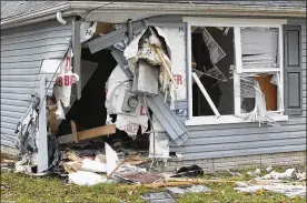  ?? CHRIS STEWART / STAFF ?? A mother and her 7-year-old son died Wednesday night after a car rammed into their house on Lilac Avenue in Dayton.