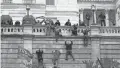 ?? AP ?? A mob scales a U.S. Capitol wall.