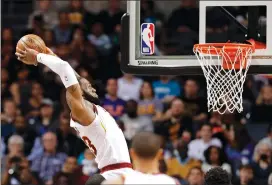  ?? Associated Press photo ?? In this March 28 file photo, Cleveland Cavaliers' LeBron James goes up to dunk against the Charlotte Hornets during the first half of an NBA basketball game in Charlotte, N.C. James, who will try to lead the Cleveland Cavaliers to their fourth straight...