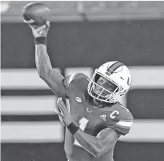  ?? AL DIAZ/AP ?? In three games, Miami quarterbac­k D’Eriq King has passed for 733 yards and six TDs with no INTs.