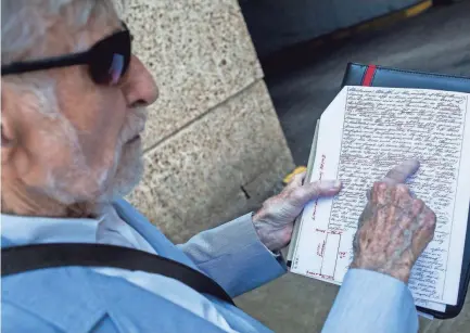  ??  ?? Don Hassell has spent years digging through old deeds, maps and other records to locate Lot 53 -- the exact site of the May 22, 1819, founding of Memphis. Here he shows off a copy of the deed for Lot 53, which he says is located at the southeast corner of Winchester and Front Street where the Cook Convention Center stands. BRAD VEST/THE COMMERCIAL APPEAL